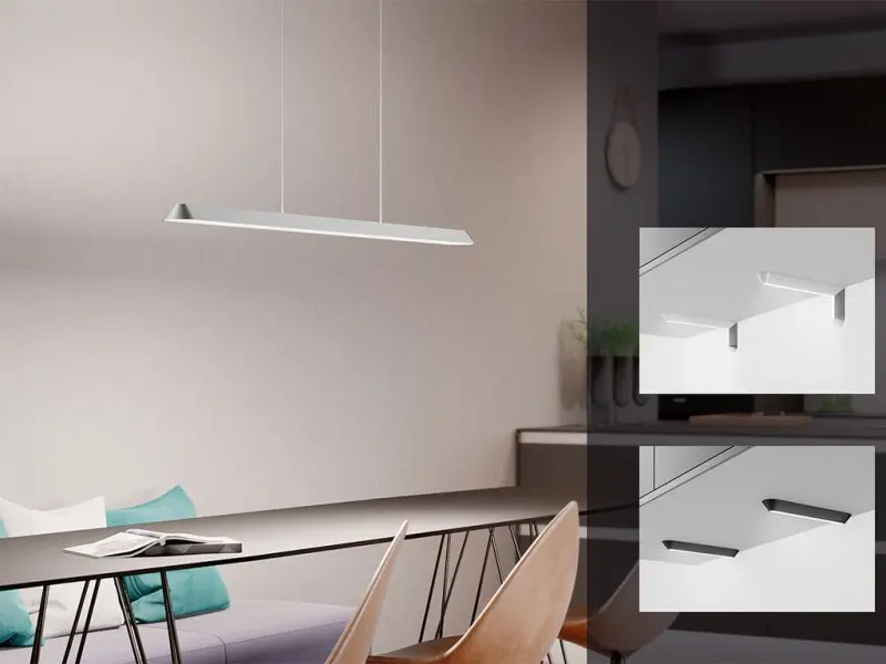 Ein modernes Esszimmer mit einer rechteckigen Pendelleuchte über einem eleganten Tisch mit zwei Stühlen, wobei der Schwerpunkt auf dem minimalistischen Design der Beleuchtung und dem Naber Küchenzubehör liegt.